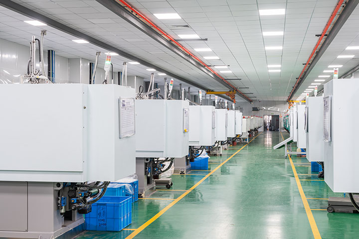numerous packaging making equipment lined up in the facility