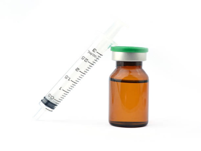 medical ampules and syringe isolated on white background